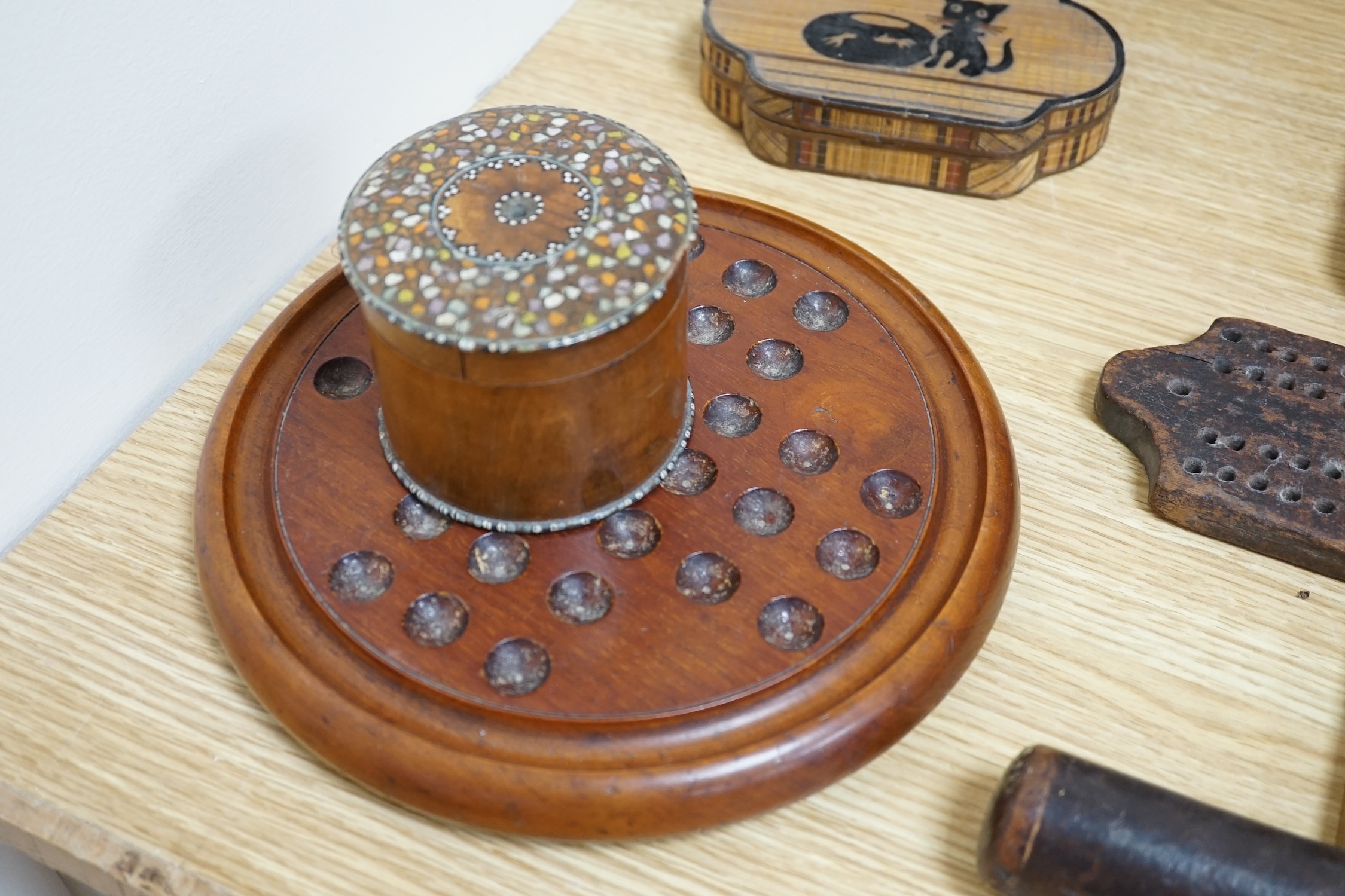 A group of wood items to include two cribbage boards, a mahogany solitaire board with marbles, a truncheon and an inlaid oval tray. etc., largest 60cm wide. Condition - varies, poor to fair